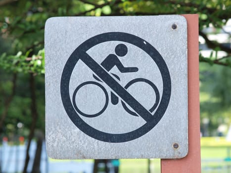 sign meaning "Bicycle are not allowed here" in city park