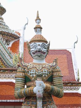native Thai style big giant statues in Wat Arun in Bangkok, Thailand