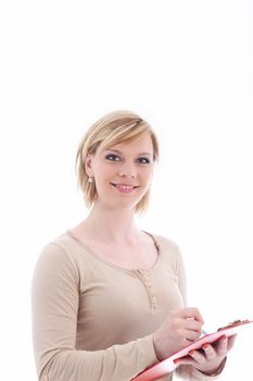 Friendly casual woman writing in a folder which she is holding in her hand isolated on white