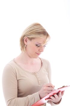 Efficient hardworking personal assistant concentrating as she takes notes in a handheld folder