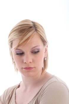 Portrait of sad blonde woman on white background