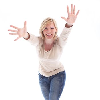 Laughing playful woman with outstretched arms and hands extended leaning towards the camera isolated on white