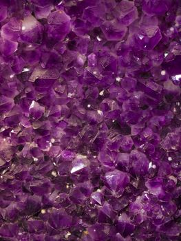 close up of purple amethyst stones background
