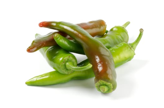 Arrangement of green Chili peppers isolated on white background