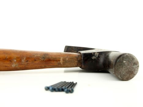 Old vintage hammer and nails for home construction         