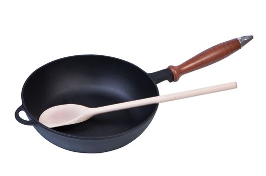 Frying pan with a wooden spoon isolated on white background.