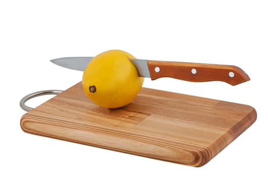 Kitchen knife cut lemon in cutting board isolated on white background.