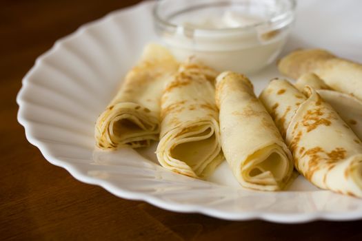 Pancakes on a plate with cream