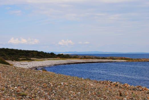 Rolling stone beach at Jomfruland, a small elongated Norwegian island located off the coast of mainland Kragerø in the county of Telemark.