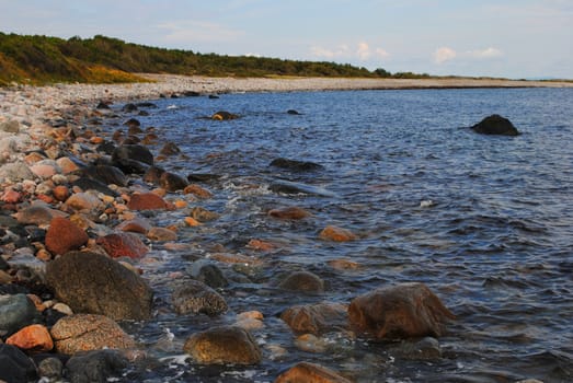 Rolling stone beach at Jomfruland, a small elongated Norwegian island located off the coast of mainland Kragerø in the county of Telemark.