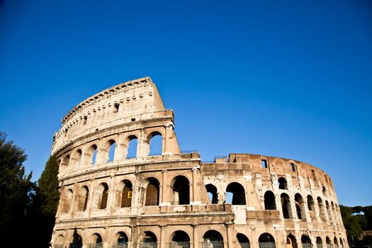 Colosseum in Rome with blue sky, landmark of the city