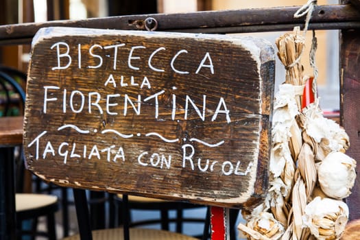 Sign made of wood with Bistecca alla Fiorentina (Florence steak) words