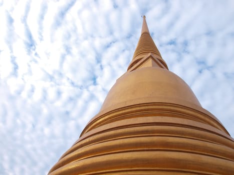 Golden Buddha Pagoda on blue sky 