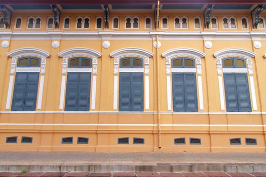 Blue windows with yellow wall  - Oriental style
