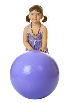 Little girl with a large rubber ball isolated on white background