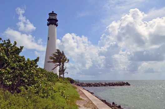Lighthouse overlooking the beach at Bill Baggs State Park on Key Biscayne,Florida a popular attraction for tourists and local residents.