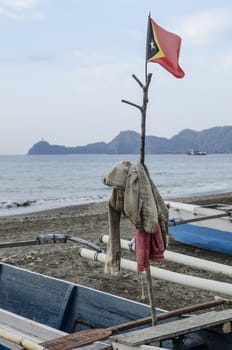 east timor flag in fishing boat dili timor leste coast