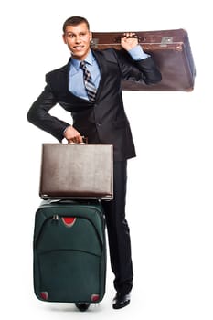 Young successful businessman in a business suit with three suitcases and a journey