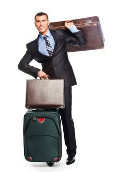Young successful businessman in a business suit with three suitcases and a journey
