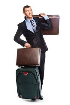 Young successful businessman in a business suit with three suitcases and a journey