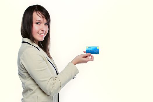 Young and beautiful girl with a credit card in the hands of blue