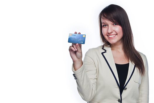 Young and beautiful girl with a credit card in the hands of blue