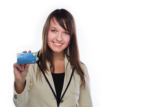 Young and beautiful girl with a credit card in the hands of blue