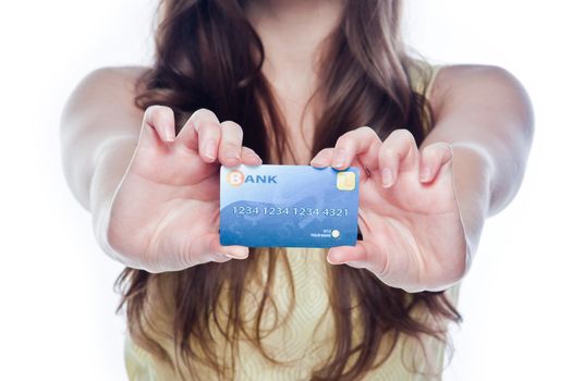 Young and beautiful girl with a credit card in the hands of blue