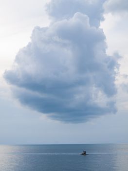 kayaking on sea and a big cloud