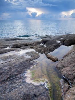 Beautiful seascape. Sea and rock at the sunset