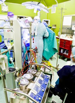 Busy surgery during operation with modern equipment