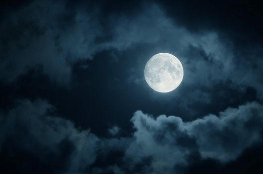 full moon over dark sky with.