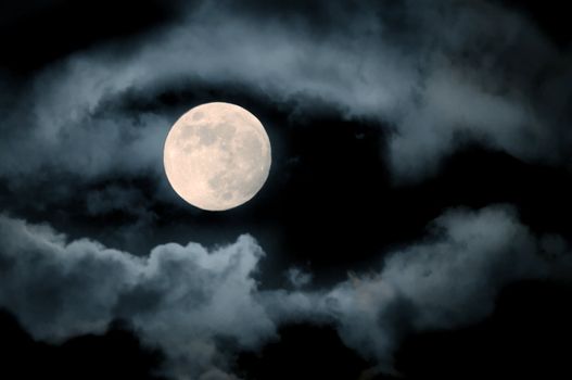 full moon over dark sky with.