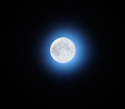 full moon over dark sky with.