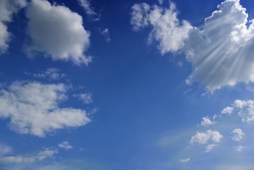 Blue sky with white fluffy clouds