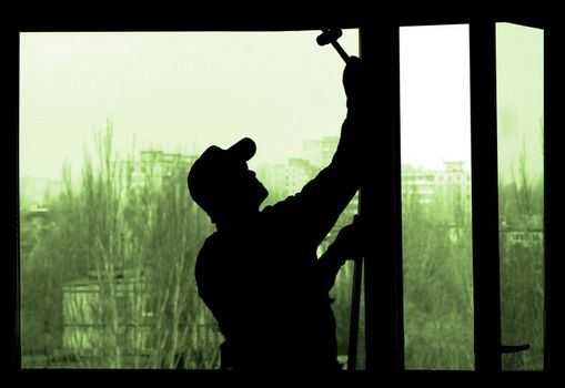 Installation of a window on a background of the house                               