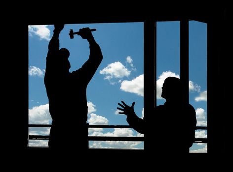 The worker on a background of clouds                               