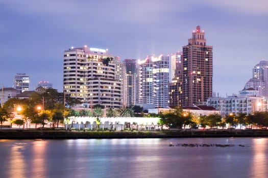 Bangkok city downtown at night with reflection of skyline, Bangkok,Thailand