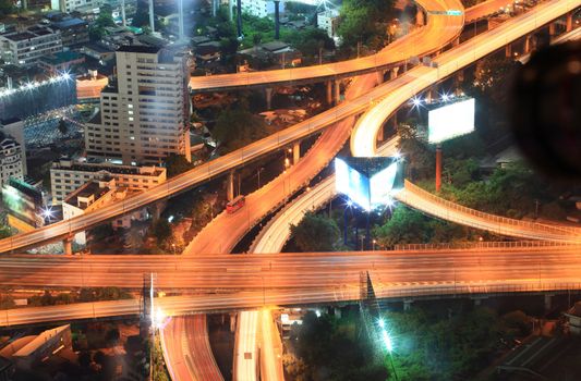 Closeup of highest Aerial view of Bangkok Highway Cityscape at Dusk in Thailand