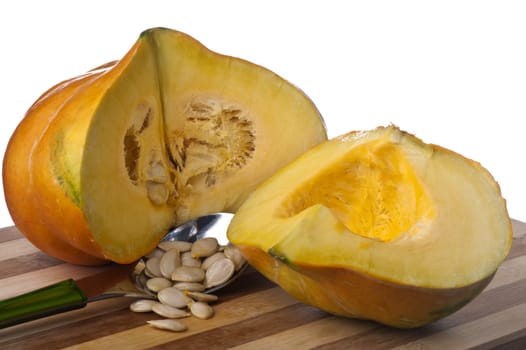 a small yellow squash on a bamboo cutting board 