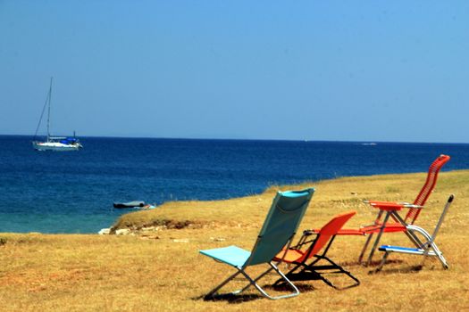 Chairs to observe beautiful sea and sailing boats.