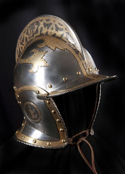 Iron helmet of the medieval knight. Very heavy headdress.