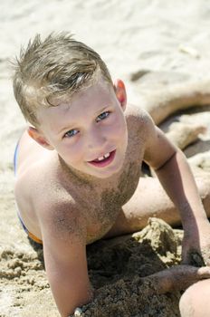 Little boy playing in the sand