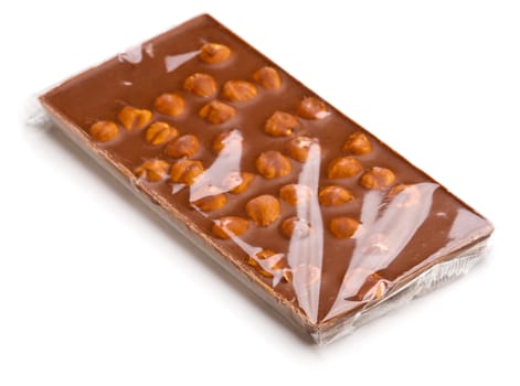 Chocolate with nuts wrapped in transparent foil.