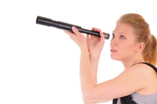 Nice blonde girl is looking far away throught telescope on white background