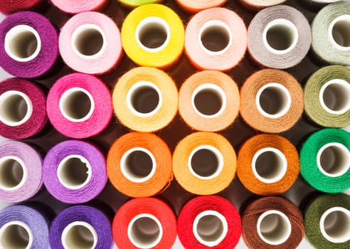 Sewing threads multicolored as a background close up