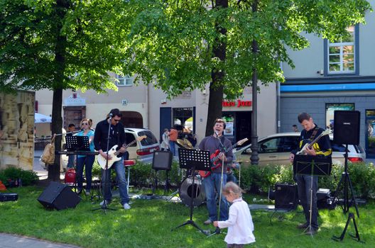 VILNIUS, LITHUANIA MAY 2012. Musicians playing guitar and singing in city center. Street music day. Free event.