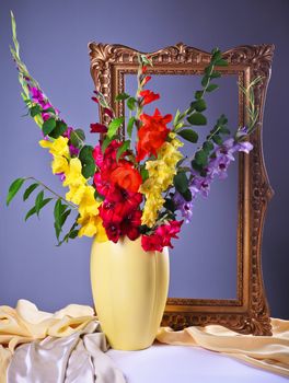 Still life with colorful  gladioluses in a vase 