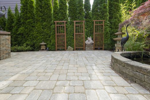 Garden Backyard Paver Patio with Pond Trellis Stone Pagoda Bronze Crane Sculptures Decoration