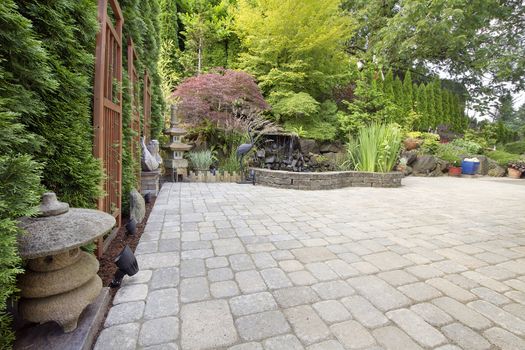 Backyard Garden Asian Inspired Paver Patio with Pagoda Pond Bronze and Stone Sculptures